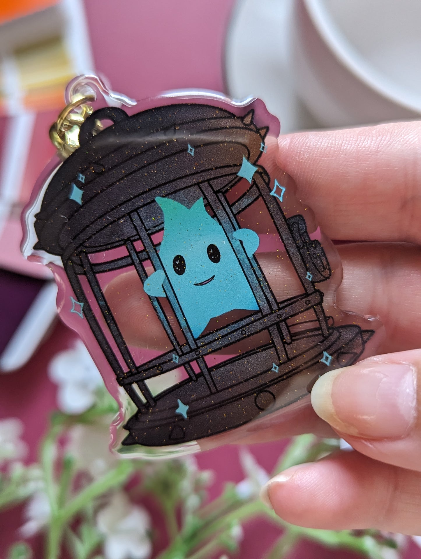 Keychain - Luma en cage